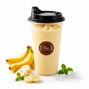 Pam’s Bakery banana shake with fresh bananas, banana slices, mint leaves, and ice