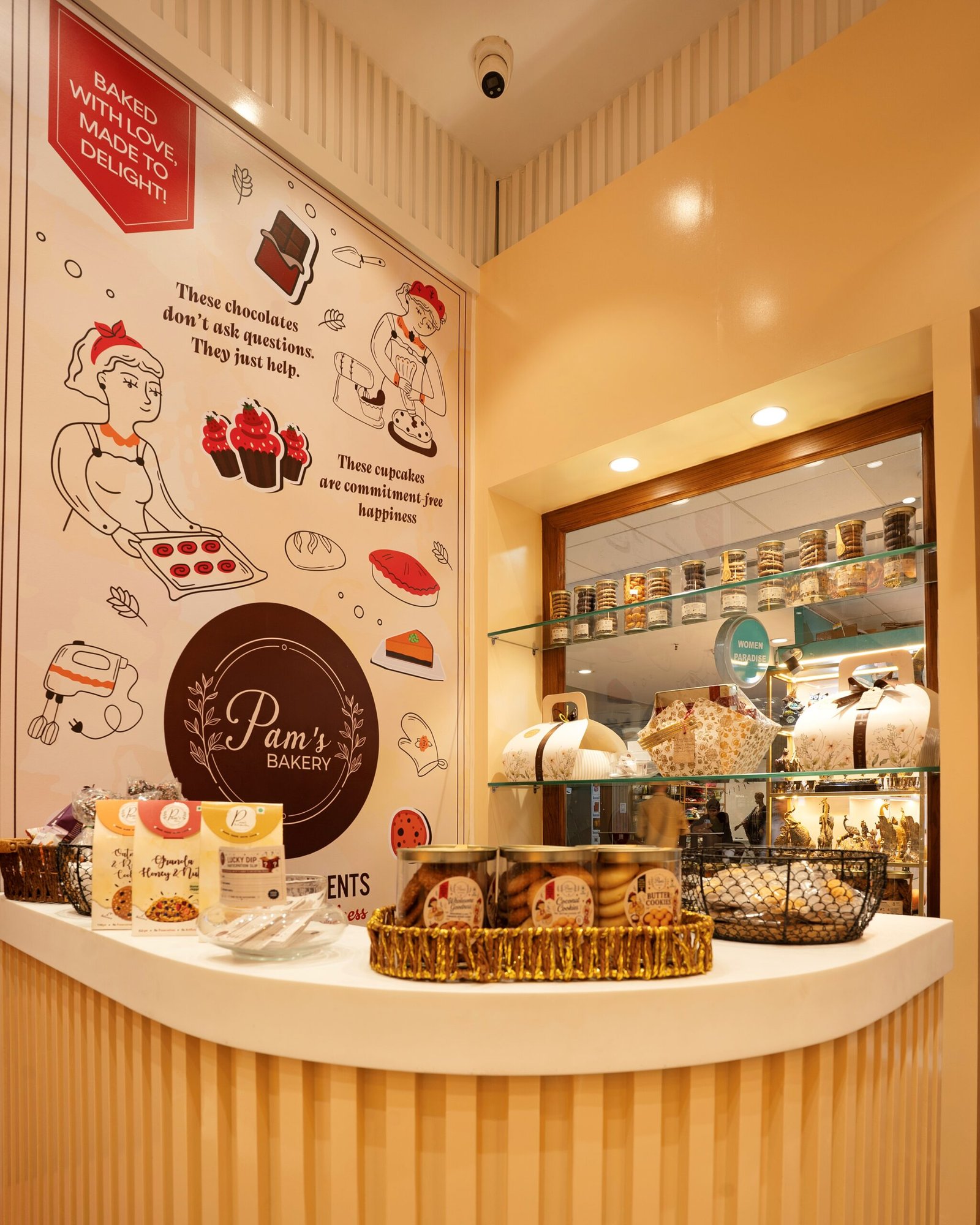 Pam’s Bakery counter displaying packaged bakery products, gift items, and fresh treats